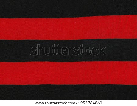Christmas and new year pattern of repetitive horizontal strips of red and black color. Red and black horizontal stripes background. fabric Seamless texture background.Pattern red and black horizontal.