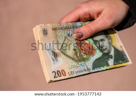 Selective focus on detail of LEI banknotes. Counting or giving Romanian LEI banknotes. World money concept, inflation and economy concept