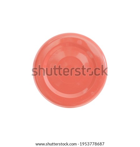Metal lid in light red color for a jar or bottle. On a white background, top view, close-up Royalty-Free Stock Photo #1953778687