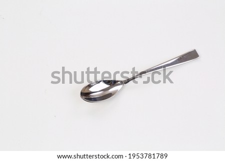 Coffee spoon on gray background