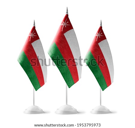 Small national flags of the Oman on a white background