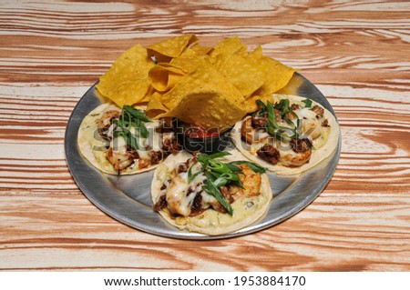Delicious authentic dish known as Shrimp and Grits Tacos
