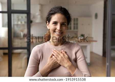 Thank you with all my heart. Portrait of grateful millennial latin woman hold hands on chest express sincere gratitude benevolence love. Touched young lady look at camera appreciate for kindness help Royalty-Free Stock Photo #1953915538