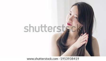Hair care concept of young asian woman. Royalty-Free Stock Photo #1953938419