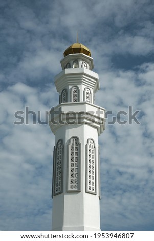 A picture of mosque minaret with beautiful cloud as background in the morning.