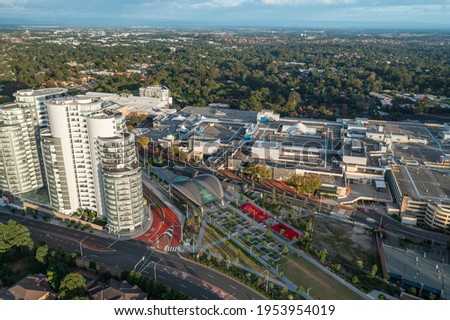 Aerial view of metro station, shopping centre, and nearby high-rise apartments, Castle Hill, Australia. Royalty-Free Stock Photo #1953954019