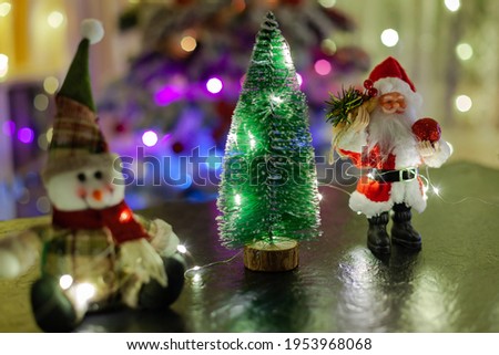 toy Christmas tree with Santa Claus and snowman