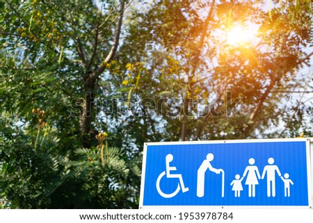 Male ,Female,children,Handicap (disabled person) toilet sign WC icon restroom symbol at the outdoor background with tree and sunlight background.