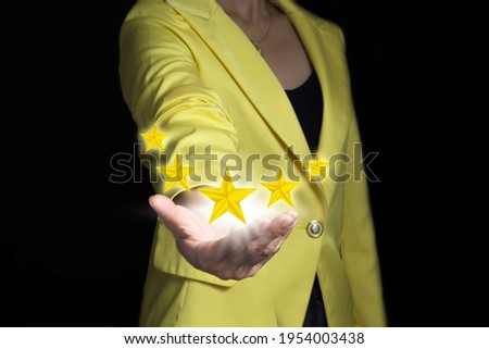 women girl in yellow suit show five star sign score on hand 