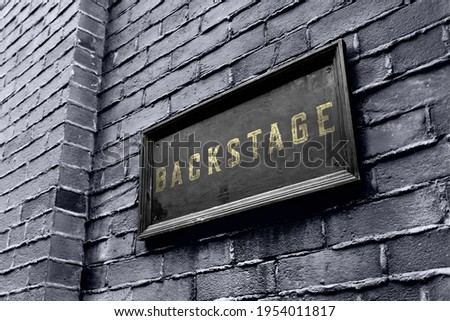 Backstage hanging signage wooden board. Business owner puts a golden black backstage sign.