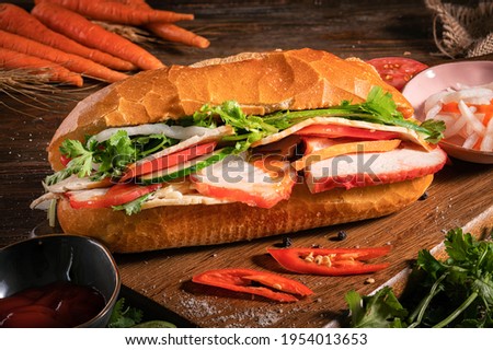 Bánh mì or banh mi is the Vietnamese word for bread. Royalty-Free Stock Photo #1954013653