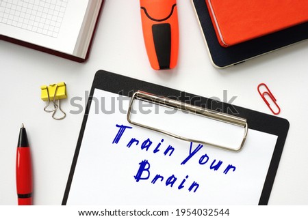 Financial concept meaning Train Your Brain with inscription on the page. 
