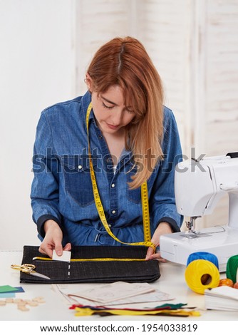 Young seamstress woman in her workshop