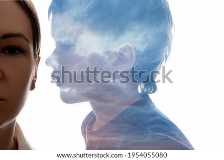 Family secret. Silhouette portrait. Children fears. Mental disorder. Silence confidence. Son saying something close to mother ear isolated on white double exposure.