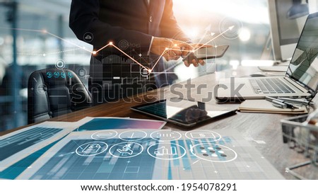 Businessman online using mobile banking payment with financial application icons. Financial innovation technology develop smart e commerce service and growth digital transaction. Digital marketing. Royalty-Free Stock Photo #1954078291