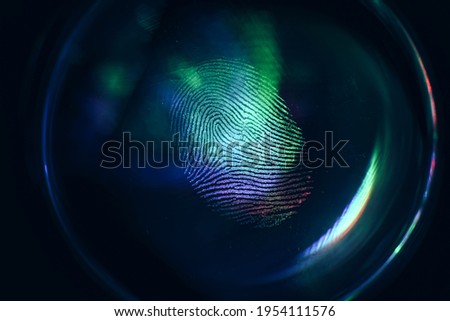 Close up beautiful abstract colored fingerprint on  background texture for design. Macro photography view. Royalty-Free Stock Photo #1954111576