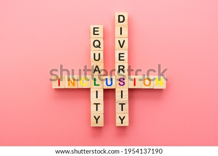 Inclusion, diversity and equality concept. Lgbtq abstract letters on wooden cubes over pink. Royalty-Free Stock Photo #1954137190