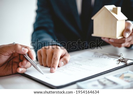 Business people signing contract making a deal with real estate agent Concept for consultant and home insurance concept