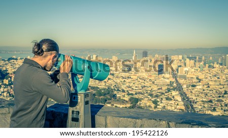 Man photographing San Francisco cityscape from Twin Peaks