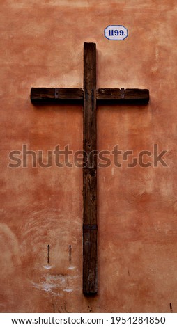 Cross on the wall, Italy