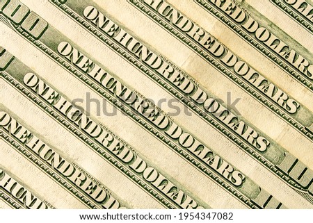 Abstract background of hundred-dollar bills. Selective focus