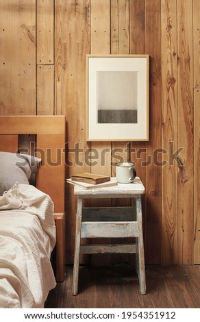 Modern graphics on a wooden background. Scandinavian interior