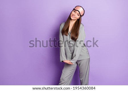 Portrait of attractive shy cheerful girl wearing pajama posing wake up isolated over violet purple color background Royalty-Free Stock Photo #1954360084