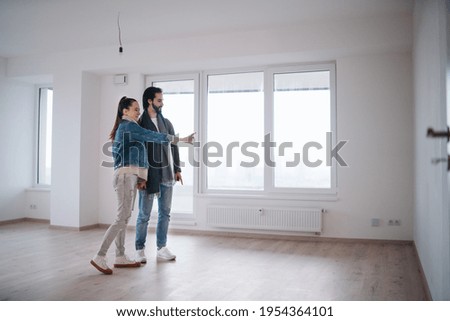 Young couple moving in new flat, new home and relocation concept. Royalty-Free Stock Photo #1954364101