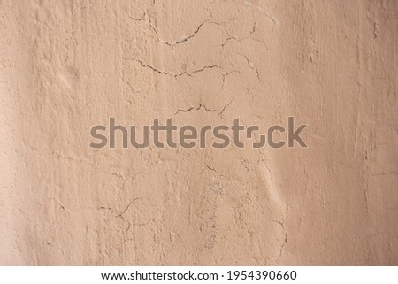 Blurred picture wall of home made from mud or adobe house. Clay wall texture of House structure. Soil building for background, vintage tone. soft picture