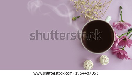 coffee cup, flower on colored background