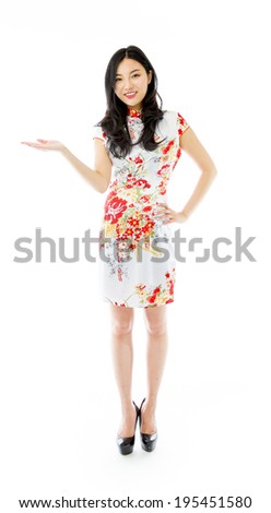 Asian happy young woman presenting isolated on white background