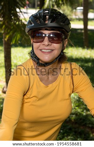 Woman wearing a helmet while riding her bike 