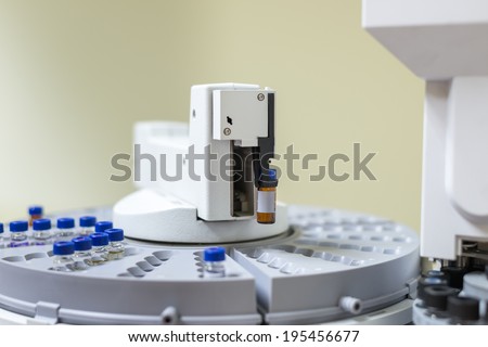 Vials in the autosampler of gas chromatography-mass spectrophotometer tray. Development of a new vaccine against the covid-19 virus. Focus on the center vials