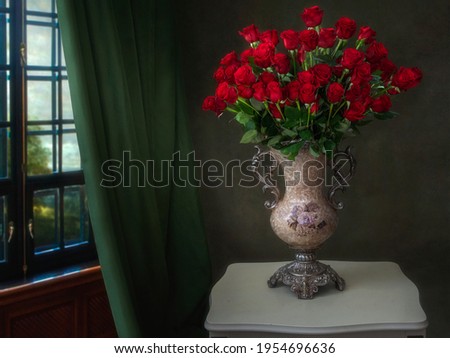 Still life with splendid bouquet of red roses