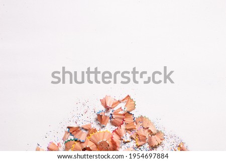 Colored shavings over white background. Top view