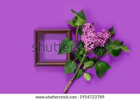 Valentine's Day card with bouquet of lilacs on paper background. Symbolic heart. 
Flat lay creative mockup , top view, copy space for text.