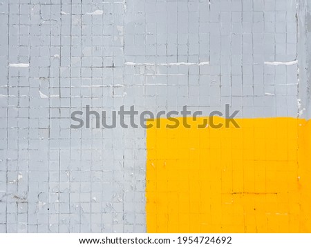 Colored duotone brick wall with trendy pantone colors of 2021 - Ultimate gray and Illuminating yellow.Grunge, old, Abstract bright background.Duotone colored concrete wall