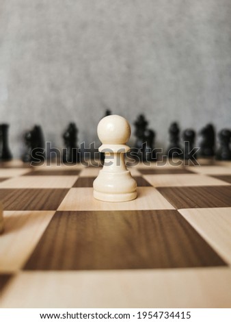 Chess pieces on a board close-up in front