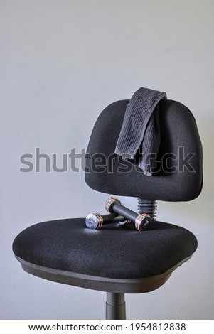 A studio photo of a black office chair