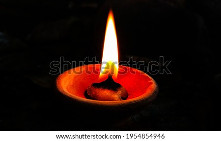 A beautiful picture of oil lamp with isolated black background diwali diya 