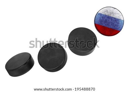 Russian hockey pucks lined up in a row on white background
