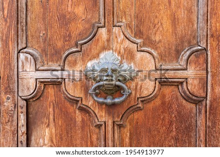 Antique wooden door with handmade center handle