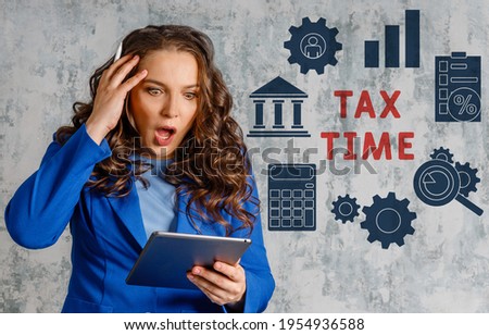 Tax time - Notification of the need to file tax return forms. Tax problem theme with young woman.  Portrait of worried young woman feeling stressed with too much.  Royalty-Free Stock Photo #1954936588