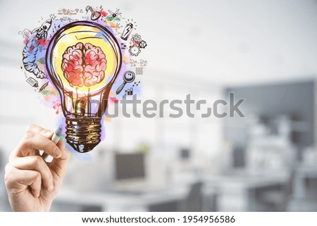 hand with a pencil touching the brain inside a lightbulb colorful sketch, coworking space in the background, researching and innovation concept