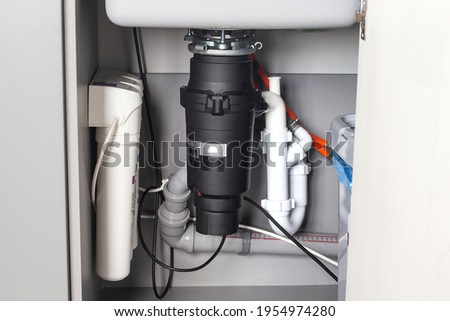 Garbage Disposal under the modern sink, waste chopper concept
 Royalty-Free Stock Photo #1954974280