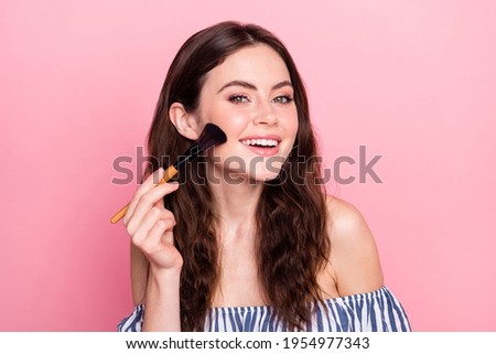 Photo of nice optimistic brunette lady apply make up wear blue dress isolated on pink color background