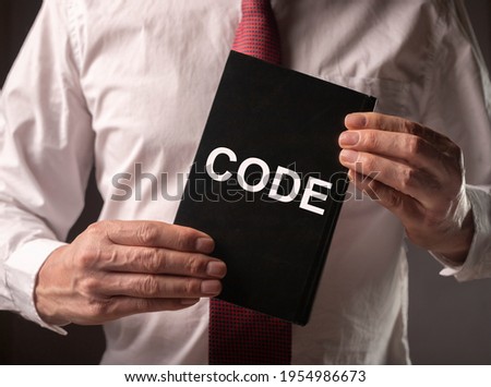 Male hands with legal code with laws, attorney, lawyer
