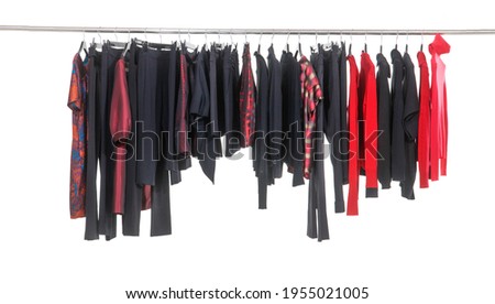 Row of different clothes, dress,, pants  for females on hanging