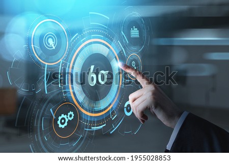 Businessman hand, finger pushing a virtual button on digital interface. Six sigma, quality control and manufacturing process management concept on screen. Royalty-Free Stock Photo #1955028853