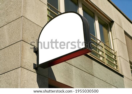 Half-round sign as a mock-up template for logo design of restaurant or cafe on building